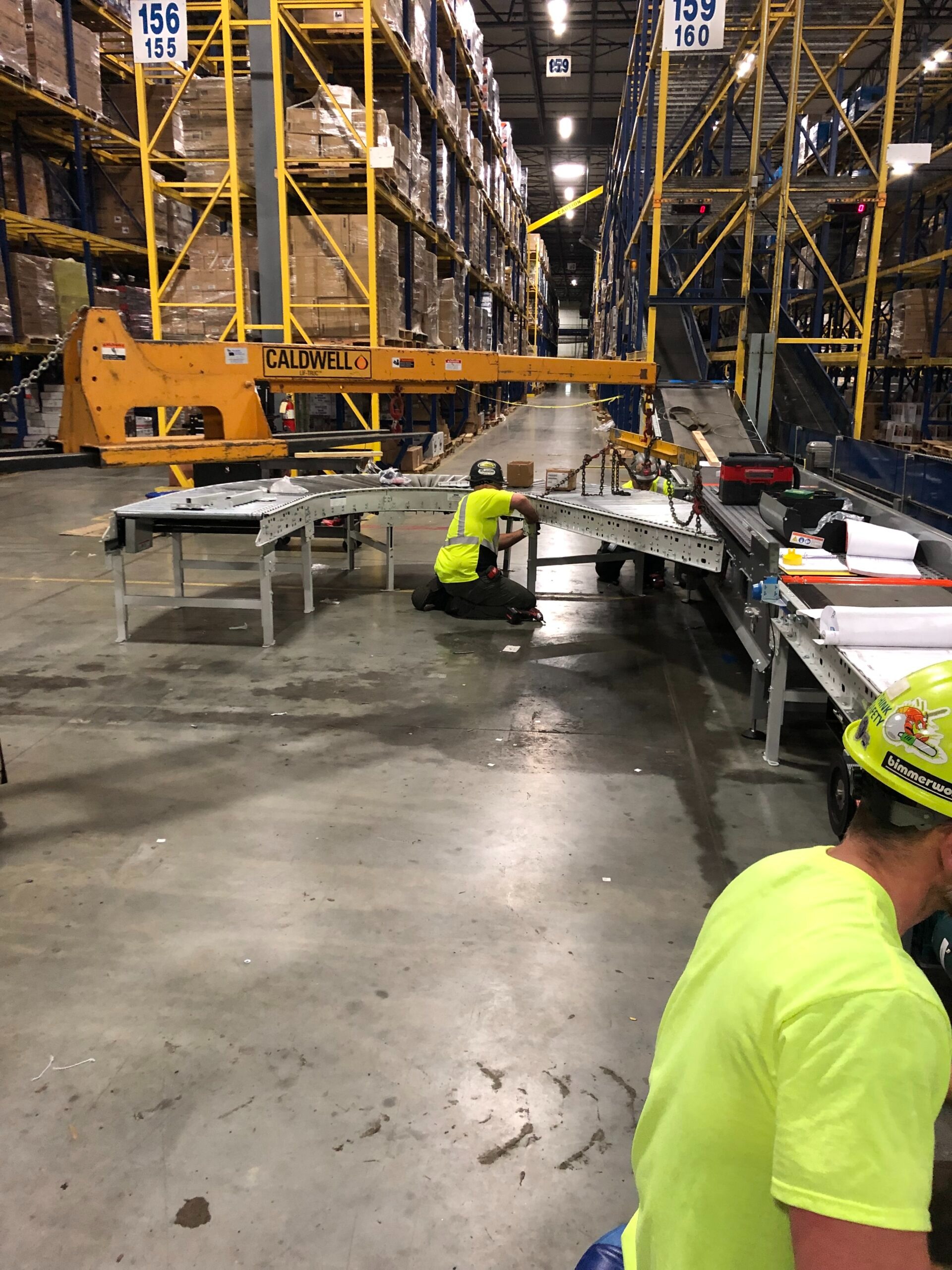 Conveyor belt system in industrial facility