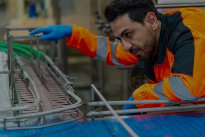 Conveyor technician responding to emergency call with tools and replacement parts